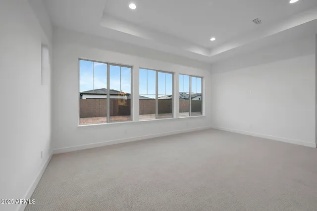 a bathroom with a tub sink double vanity granite and tub