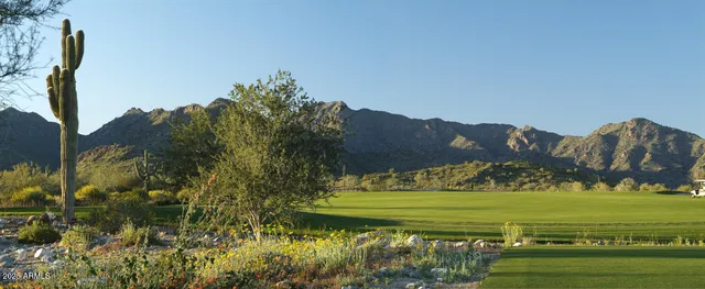 a view of a patio with a table and chairs