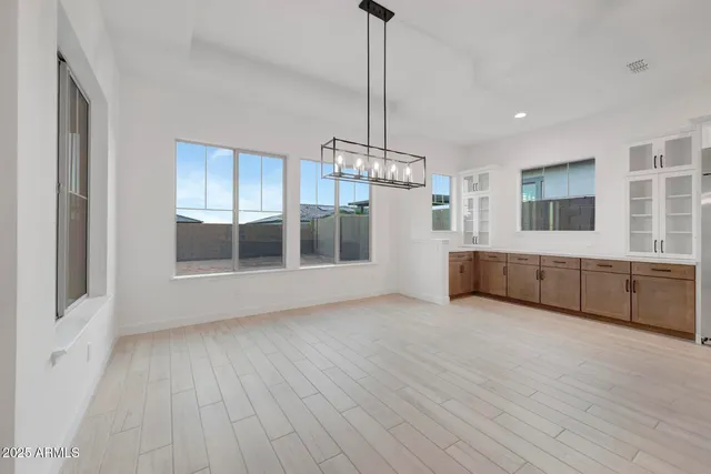 a big room with closet and wooden cabinet