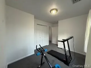a view of a room with furniture and wooden floor