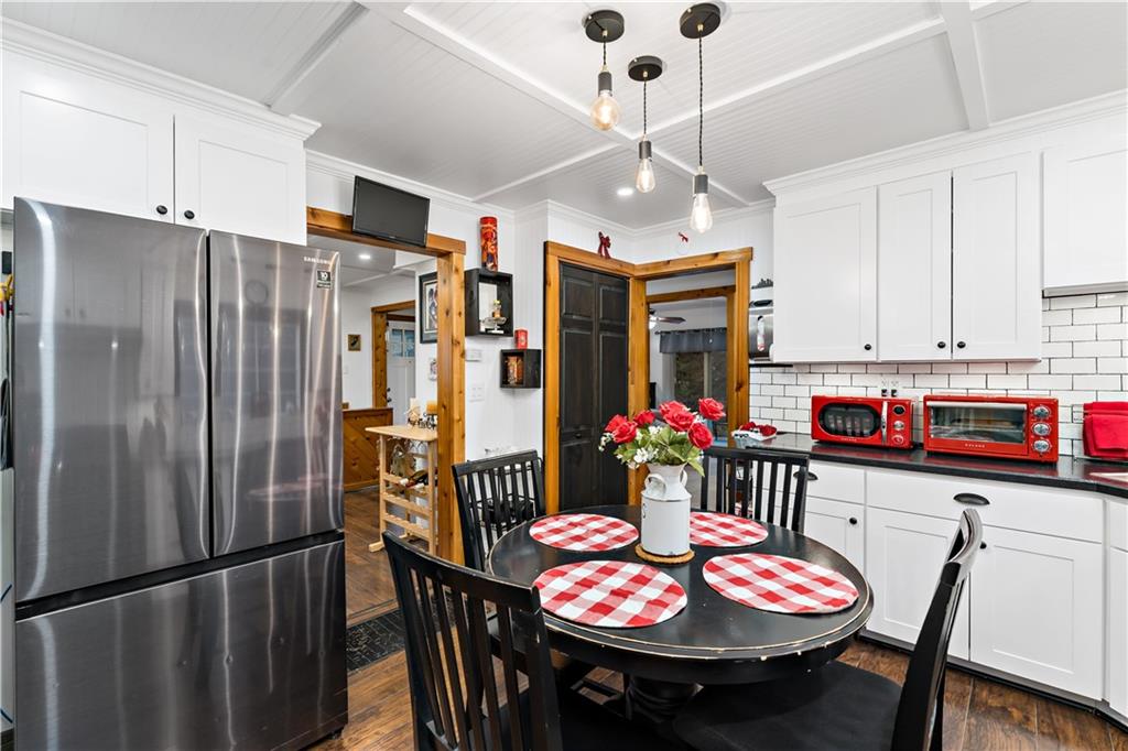 3354 Millers Run Road Cecil, PA 15321 - Photo 11 of 45 a kitchen with stainless steel appliances granite countertop a dining table and chairs