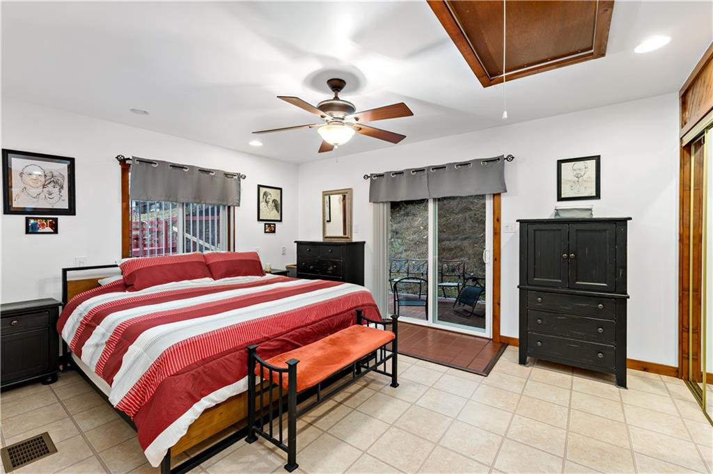 3354 Millers Run Road Cecil, PA 15321 - Photo 12 of 45 a bedroom with a bed and a chandelier