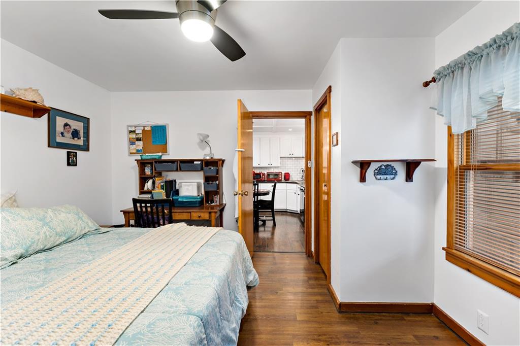 3354 Millers Run Road Cecil, PA 15321 - Photo 18 of 45 a bedroom with a bed and a chandelier