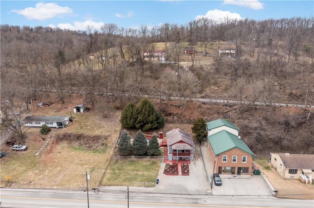 3354 Millers Run Road Cecil, PA 15321 - Photo 40 of 45 an aerial view of a house with a yard and mountain view in back