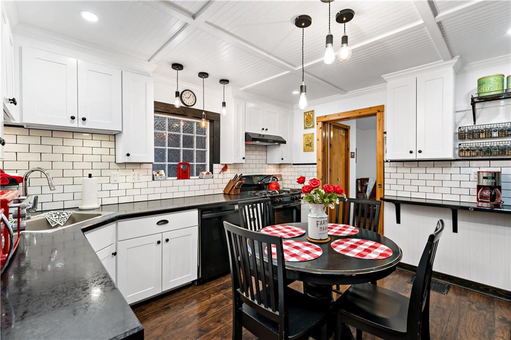 3354 Millers Run Road Cecil, PA 15321 - Photo 4 of 45 a kitchen with stainless steel appliances kitchen island granite countertop a dining table chairs sink and cabinets