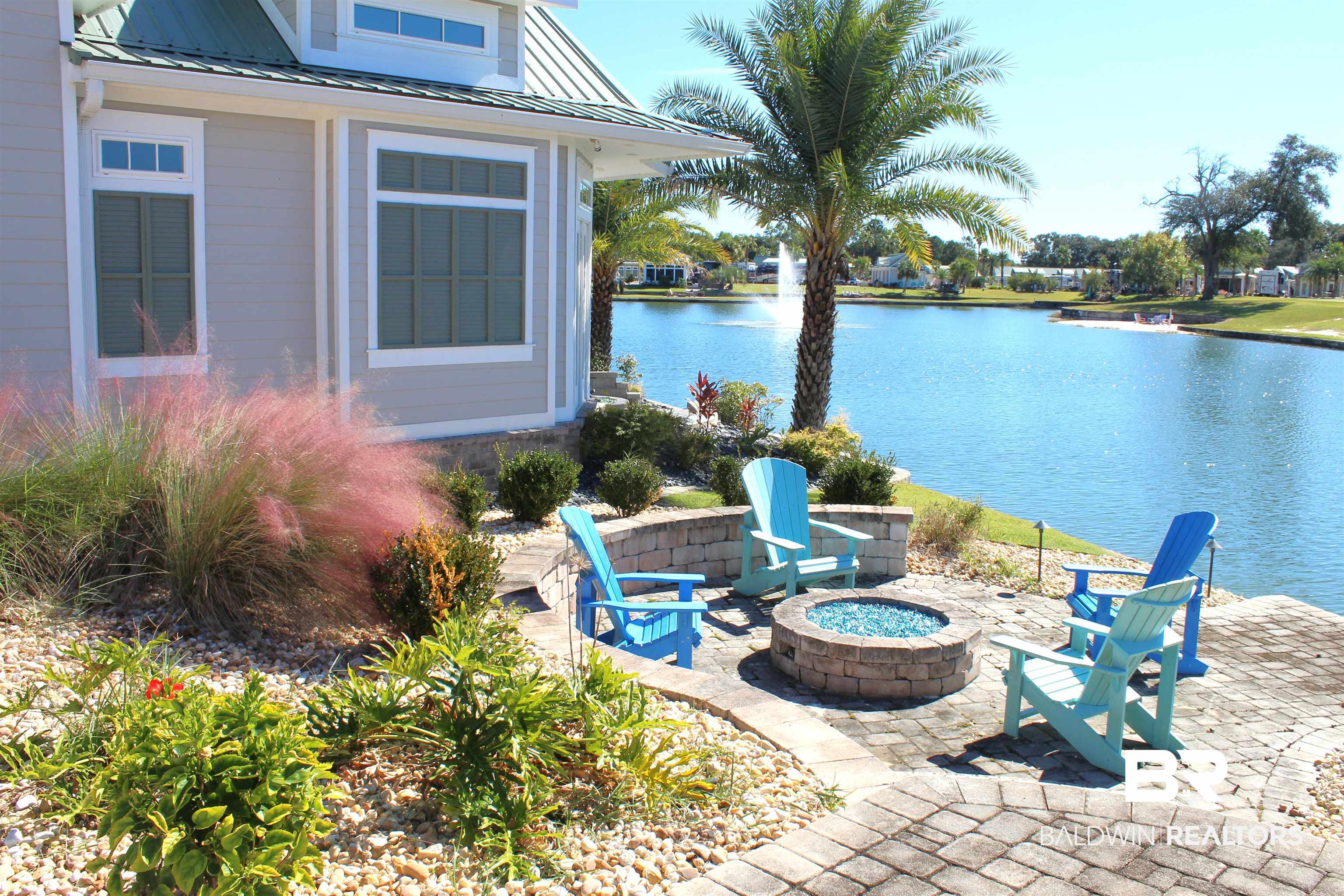 28152 Migratory Way Elberta, AL 36530 - Photo 6 of 54 View of patio / terrace featuring an outdoor fire pit and a water view