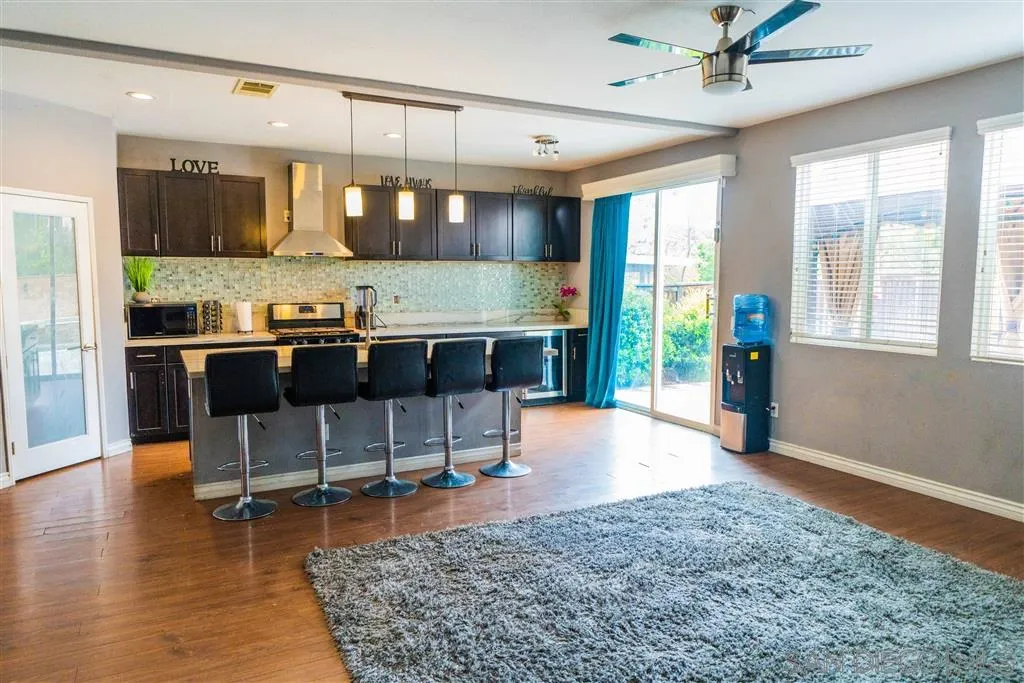 38917 Rockinghorse Road Murrieta, CA 92563 - Photo 4 of 22 a kitchen with a table and chairs in it