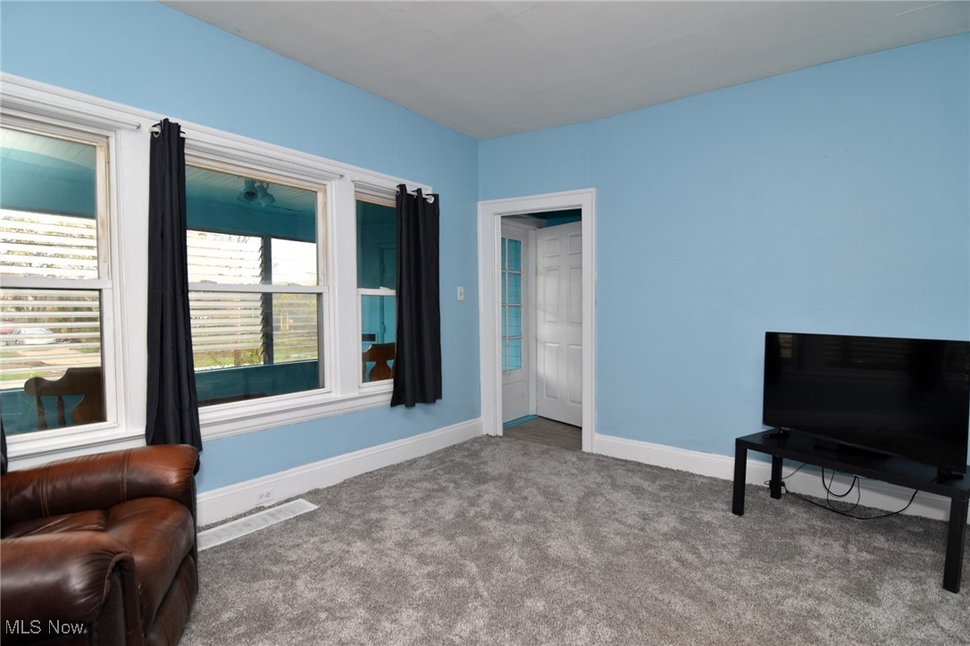 4213 Valley Road Cleveland, OH 44109 - Photo 7 of 47 Sitting room featuring baseboards, visible vents, and carpet floors