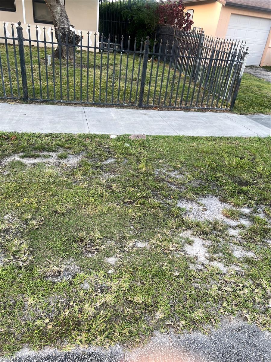 9945 Southwest 164th Terrace, Unit 1 Miami, FL 33157 - Photo 7 of 8 a view of a backyard
