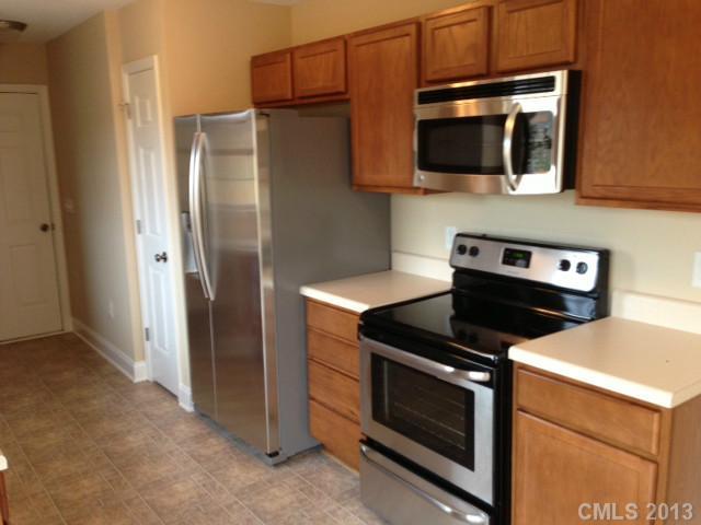 115 North Castleview Road Salisbury, NC 28146 - Photo 4 of 12 a kitchen with a stove and a microwave