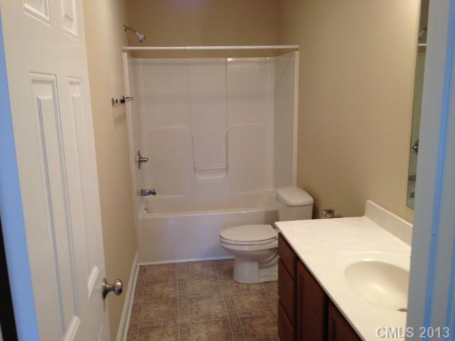 115 North Castleview Road Salisbury, NC 28146 - Photo 7 of 12 a bathroom with a sink a toilet and shower