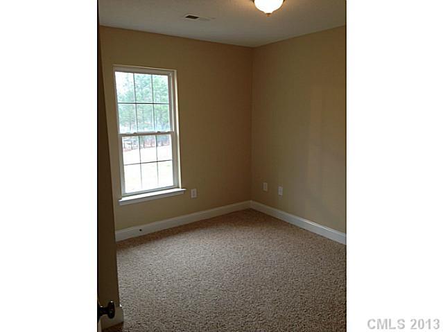 115 North Castleview Road Salisbury, NC 28146 - Photo 9 of 12 a view of an empty room with a window