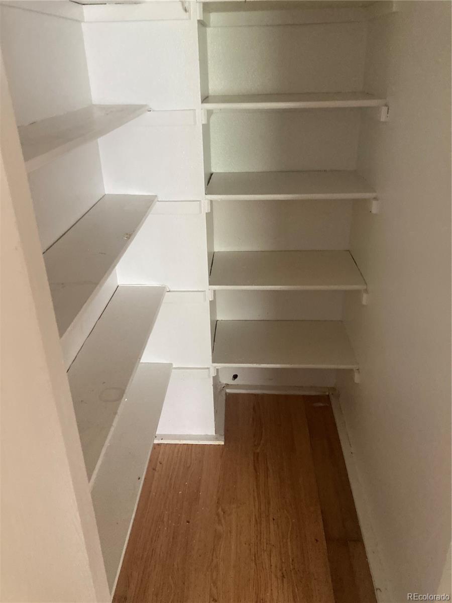 482 South Kalispell Way, Unit E Aurora, CO 80017 - Photo 5 of 12 a view of walk in closet with empty racks