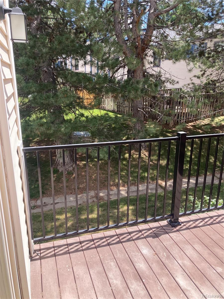 482 South Kalispell Way, Unit E Aurora, CO 80017 - Photo 7 of 12 a view of balcony with wooden floor
