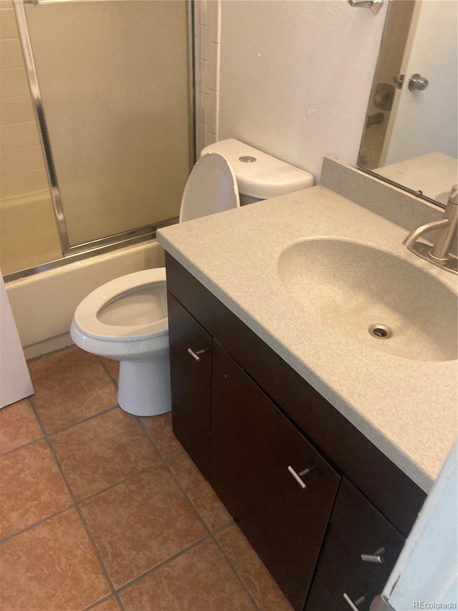 482 South Kalispell Way, Unit E Aurora, CO 80017 - Photo 9 of 12 a bathroom with a sink and a toilet
