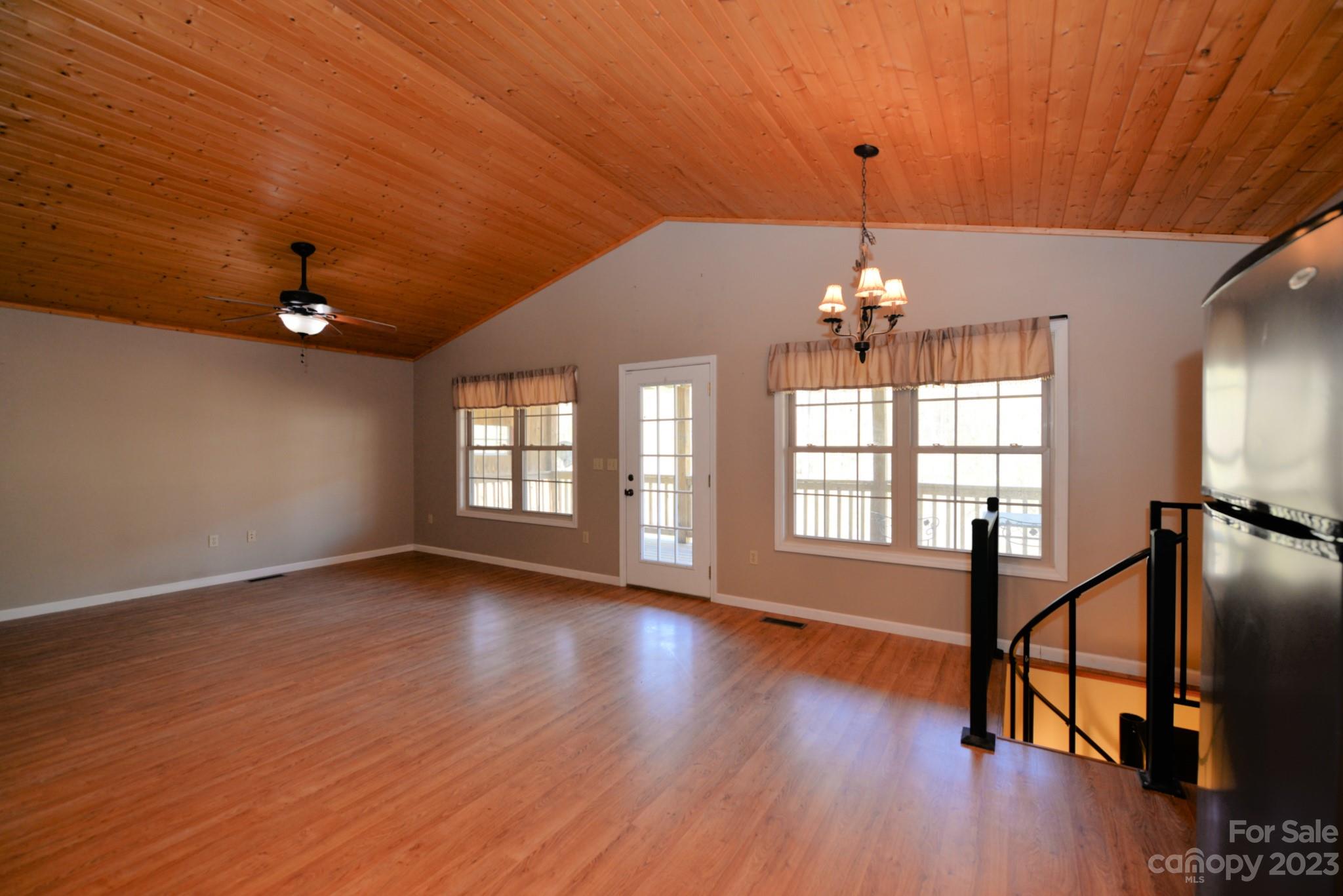 99 Bayside Drive Sylva, NC 28779 - Photo 14 of 34 a view of empty room with wooden floor and fan