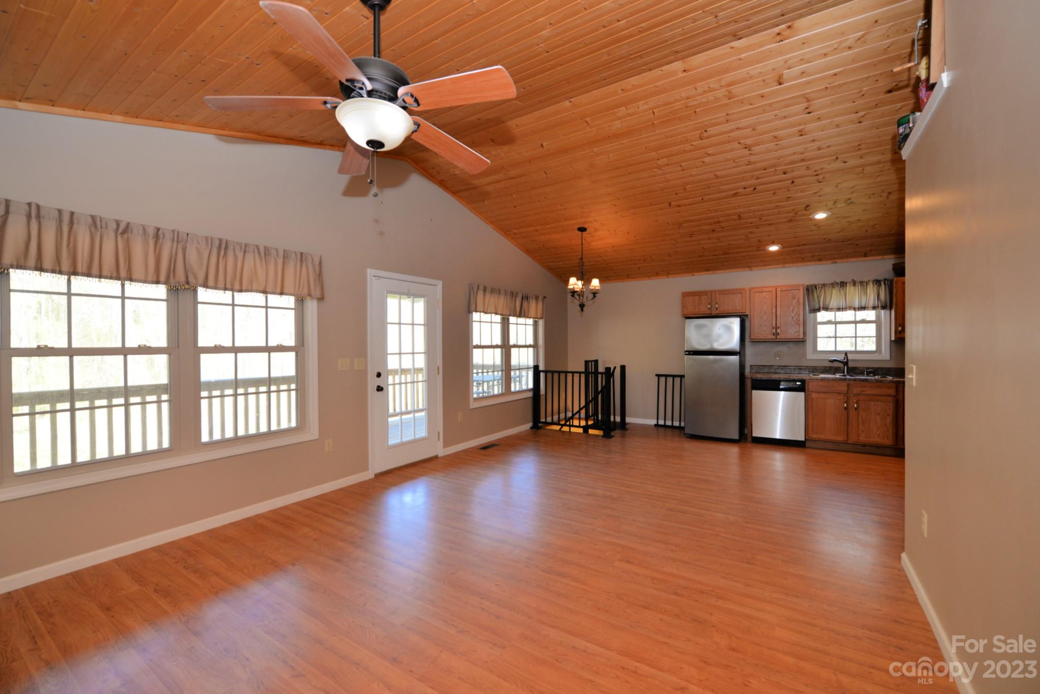 99 Bayside Drive Sylva, NC 28779 - Photo 15 of 34 a view of an empty room with window and wooden floor