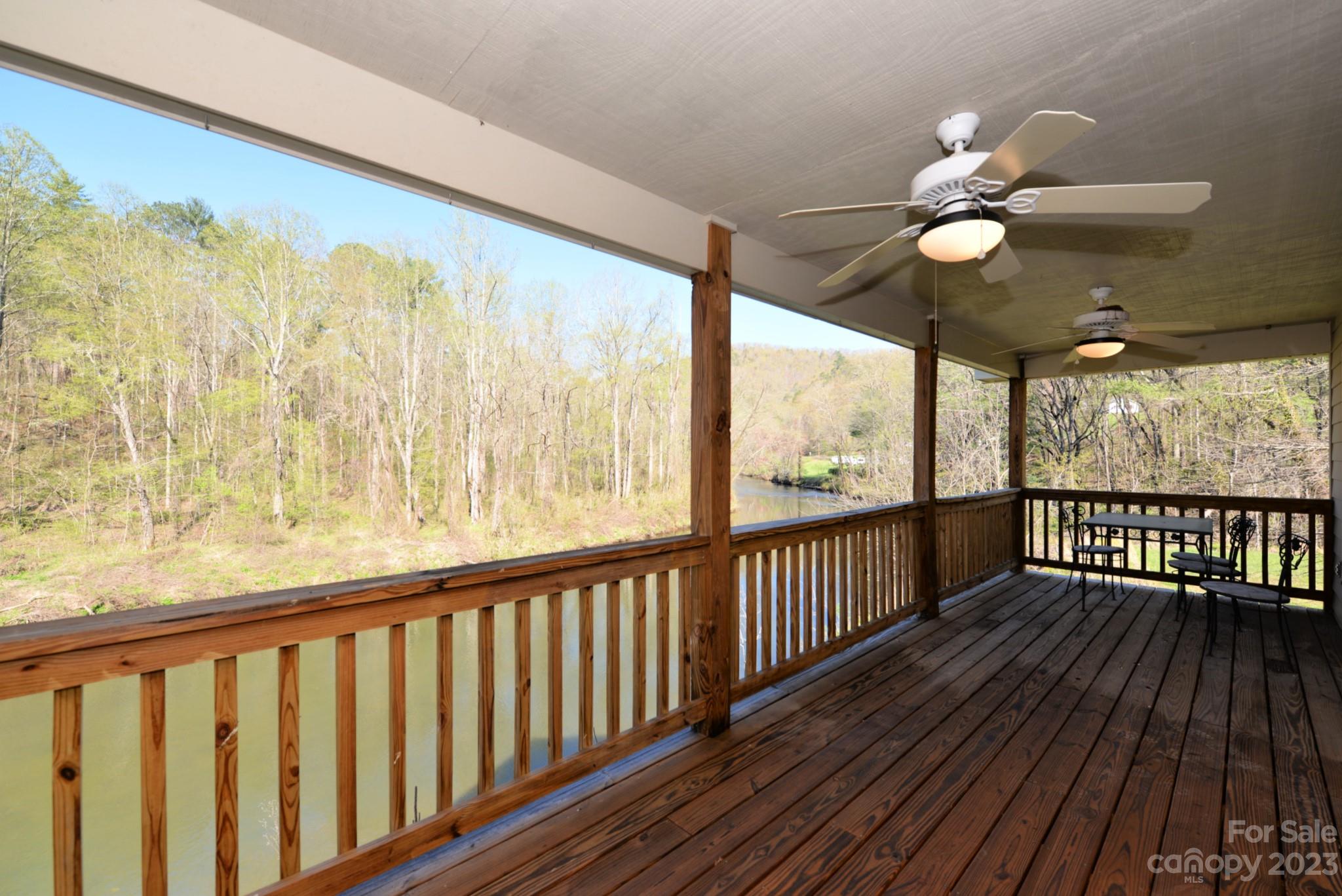 99 Bayside Drive Sylva, NC 28779 - Photo 16 of 34 a view of a porch with wooden floor