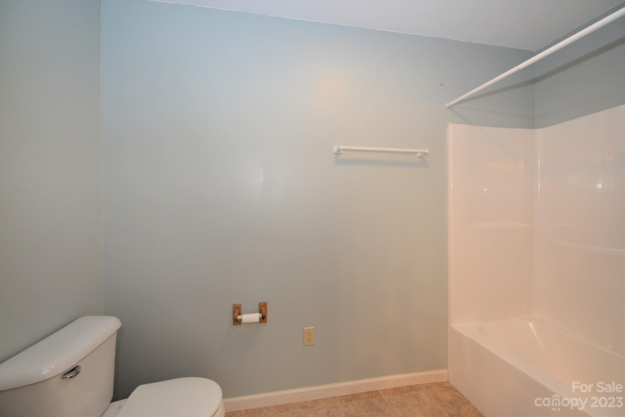 99 Bayside Drive Sylva, NC 28779 - Photo 25 of 34 a white toilet sitting next to a shower