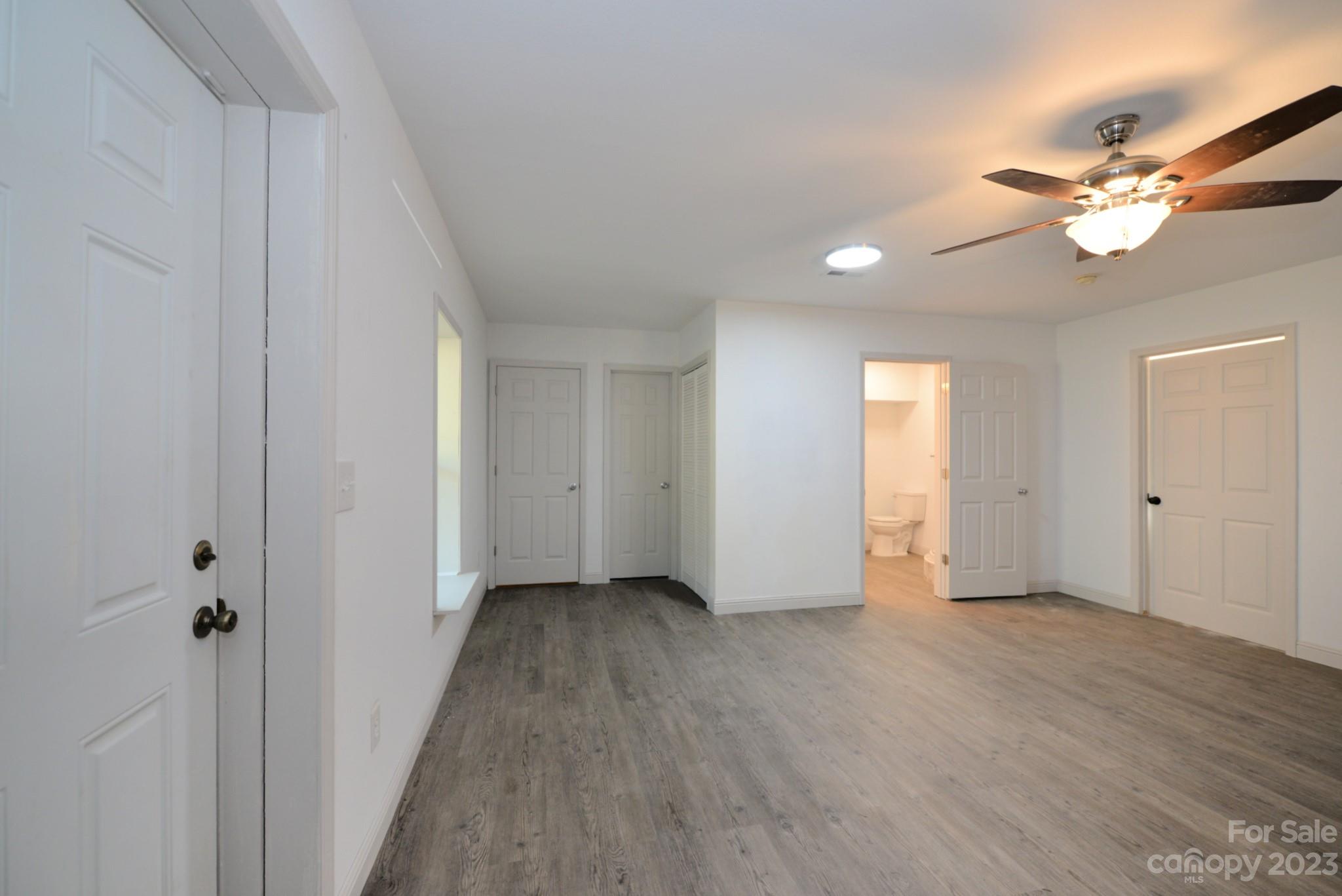 99 Bayside Drive Sylva, NC 28779 - Photo 28 of 34 a view of an empty room with wooden floor