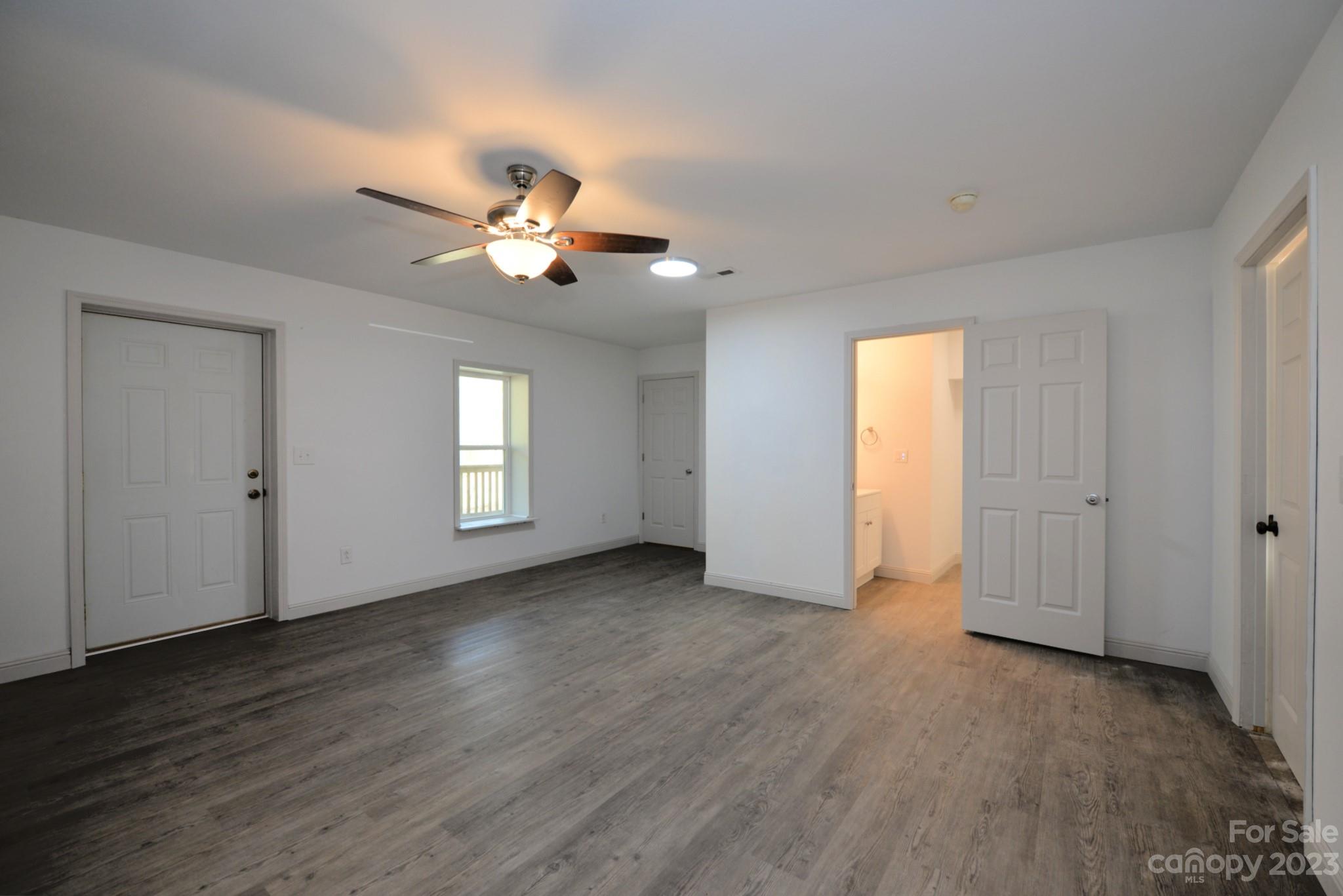 99 Bayside Drive Sylva, NC 28779 - Photo 30 of 34 wooden floor in an empty room with a window
