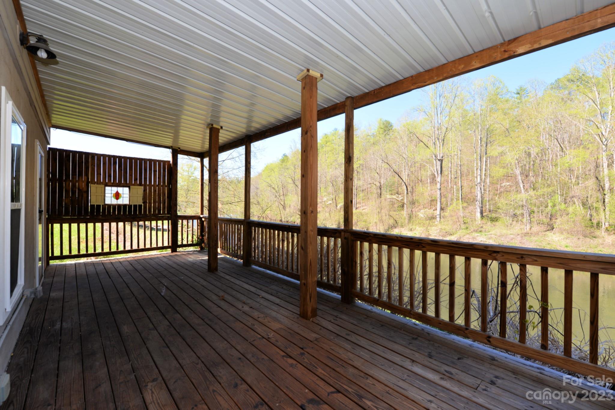 99 Bayside Drive Sylva, NC 28779 - Photo 32 of 34 a view of a porch with wooden floor