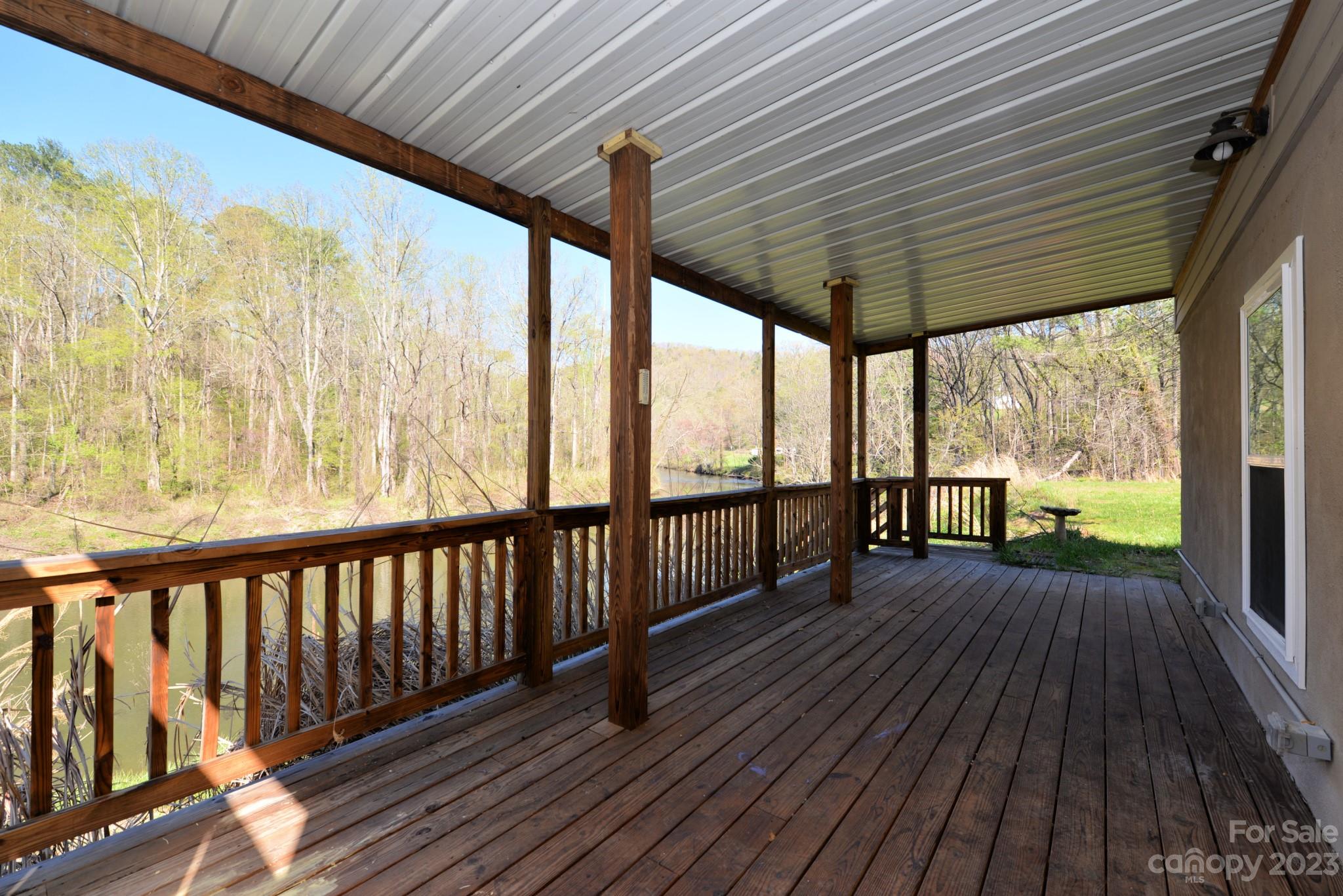 99 Bayside Drive Sylva, NC 28779 - Photo 33 of 34 a view of porch with wooden floor in front of a house