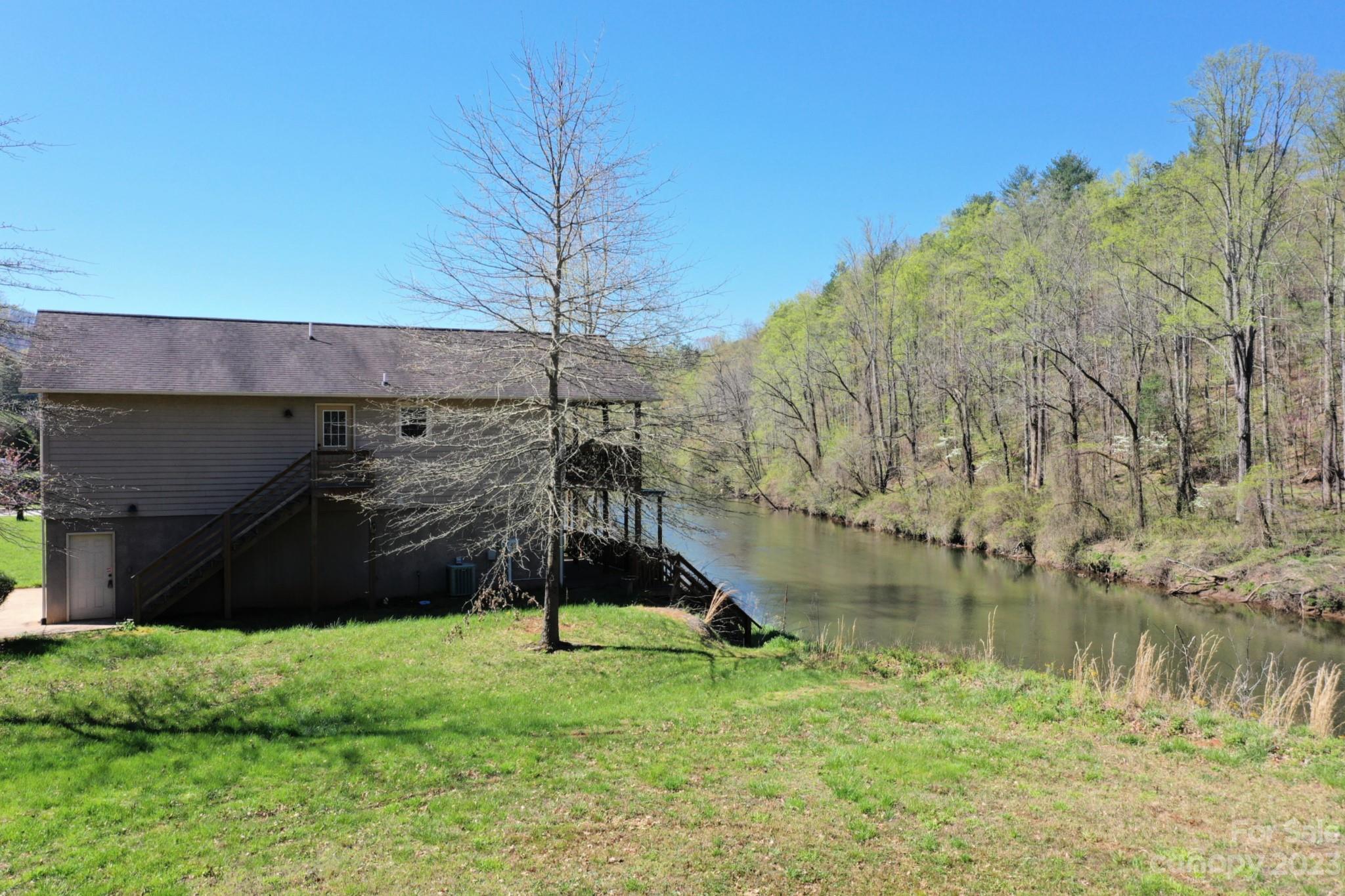99 Bayside Drive Sylva, NC 28779 - Photo 6 of 34 a view of a lake in front of house