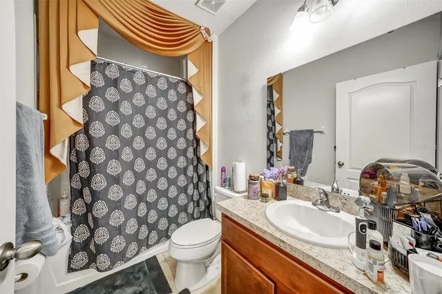 a bedroom with a bed and dresser