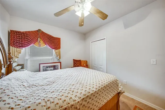 a view of a hallway with wooden floor and a living room