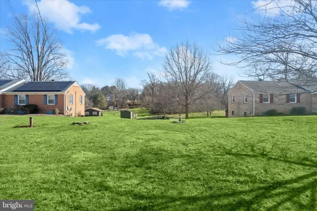 a view of grassy field with trees