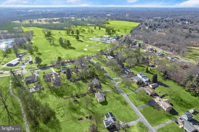 an aerial view of huge green field with lots of green plants in it