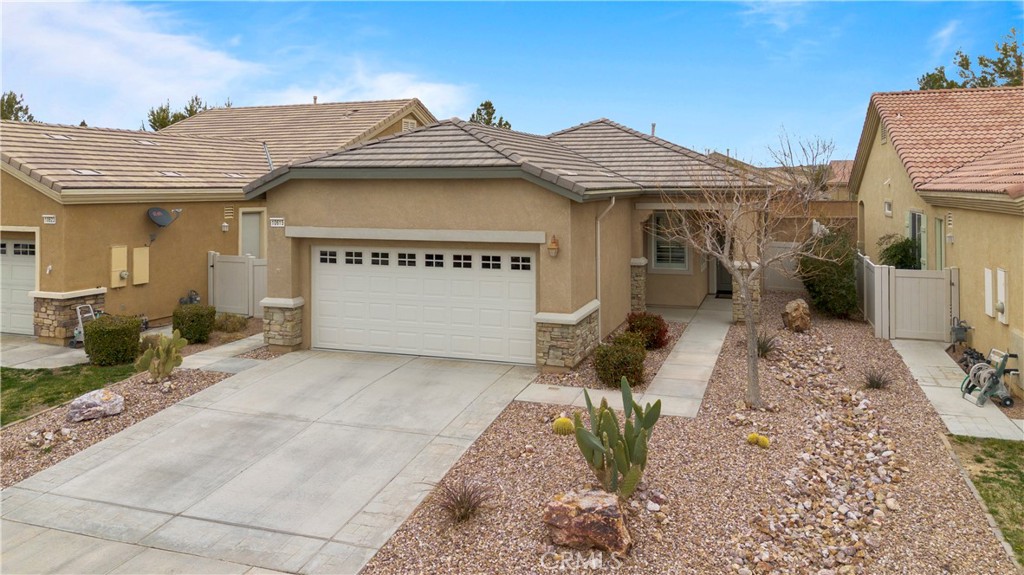 a view of a white house with a outdoor space