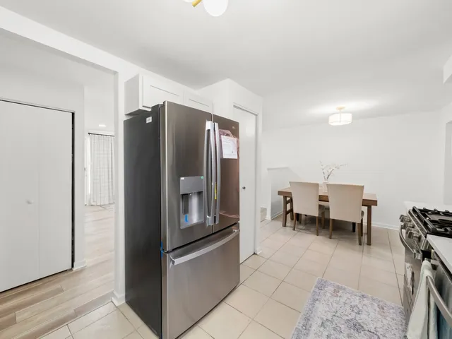 a kitchen with stainless steel appliances refrigerator and cabinets