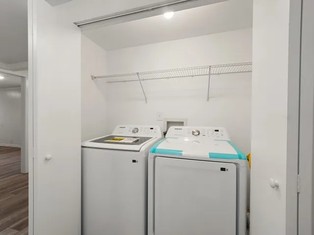 a utility room with dryer and washer