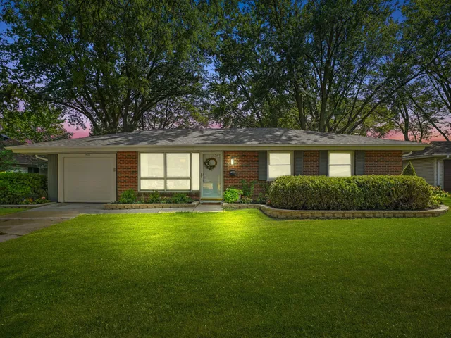a view of pool with a garden and plants