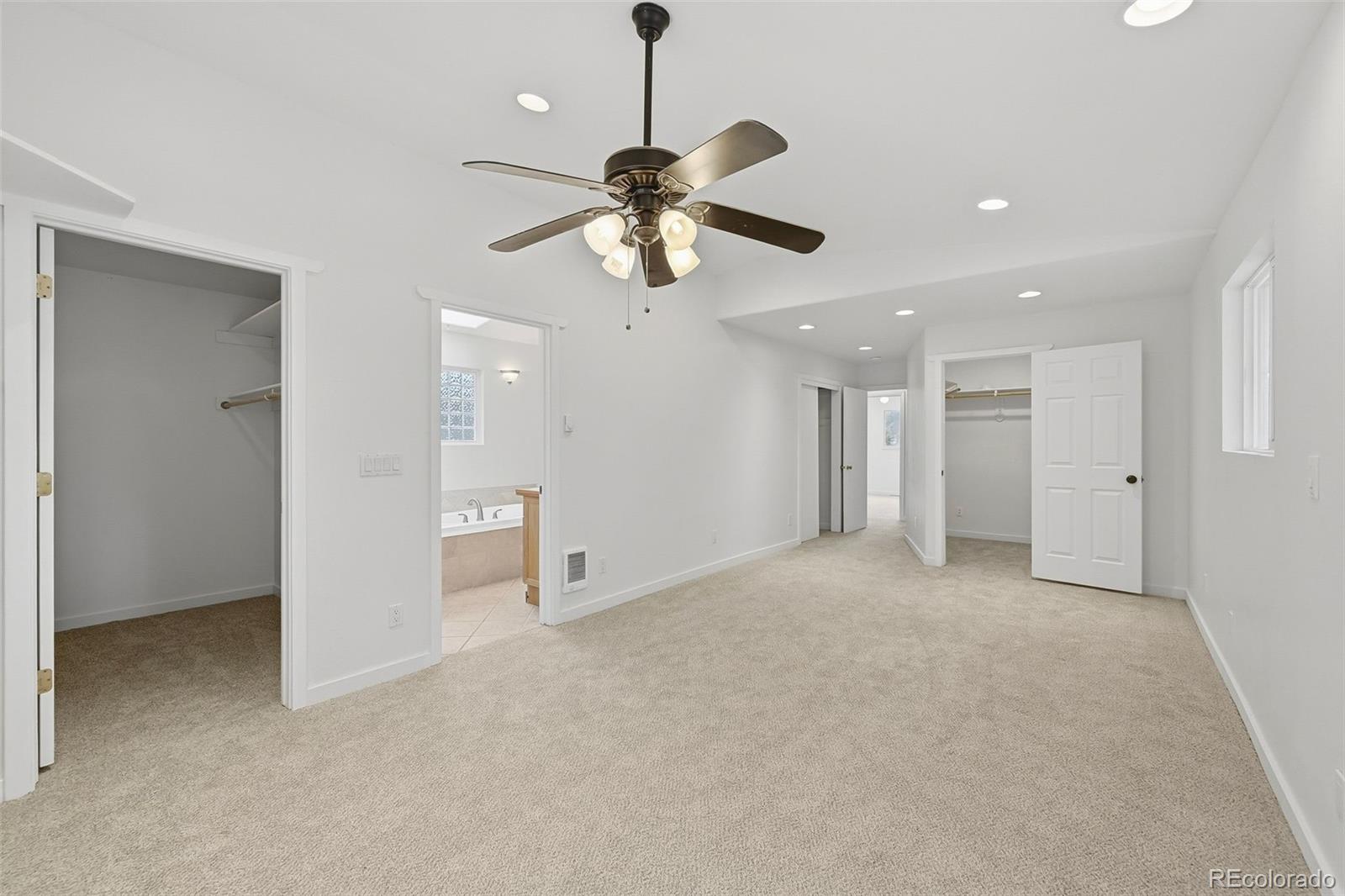 7020 Wildridge Road Colorado Springs, CO 80908 - Photo 26 of 45 a view of an empty room and a ceiling fan