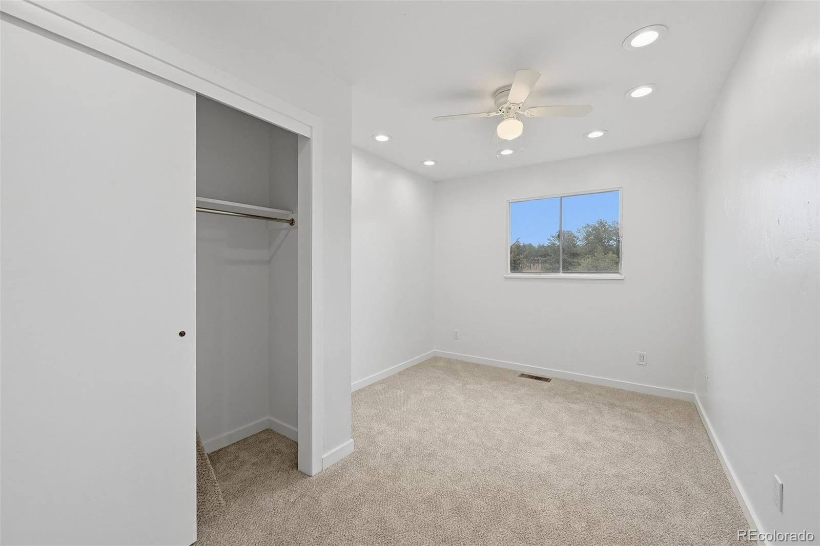 7020 Wildridge Road Colorado Springs, CO 80908 - Photo 31 of 45 an empty room with a empty space and window