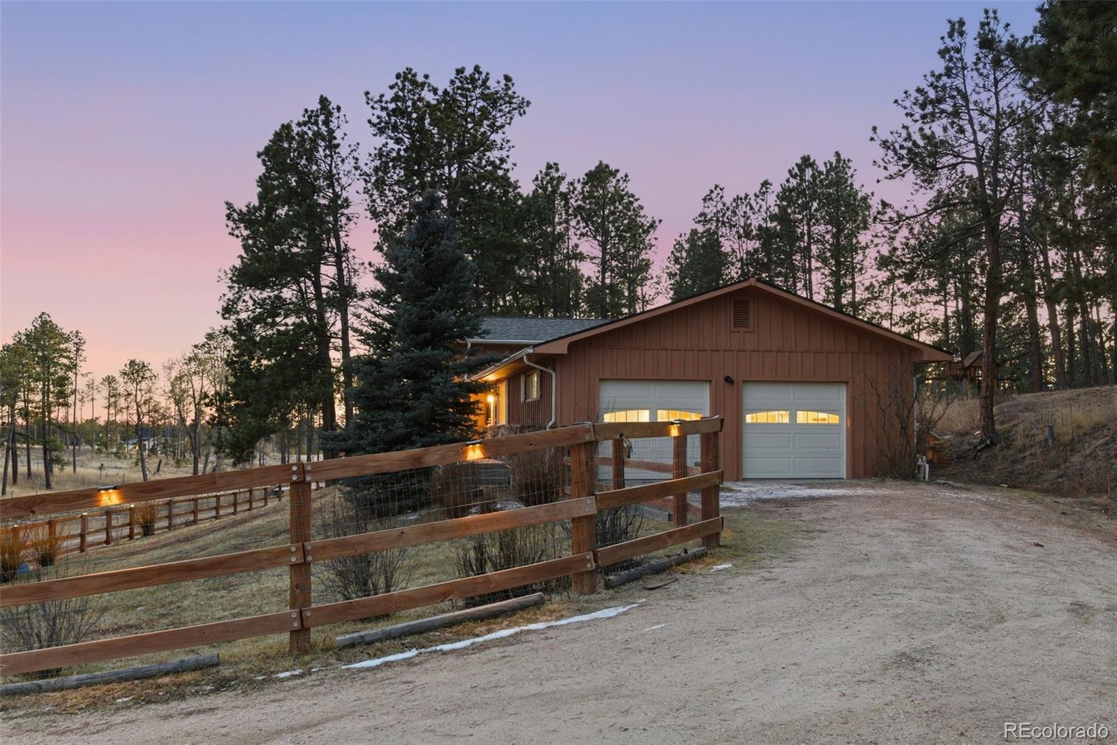 7020 Wildridge Road Colorado Springs, CO 80908 - Photo 4 of 45 a front view of a house with a yard