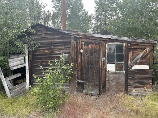a side view of a house with a yard