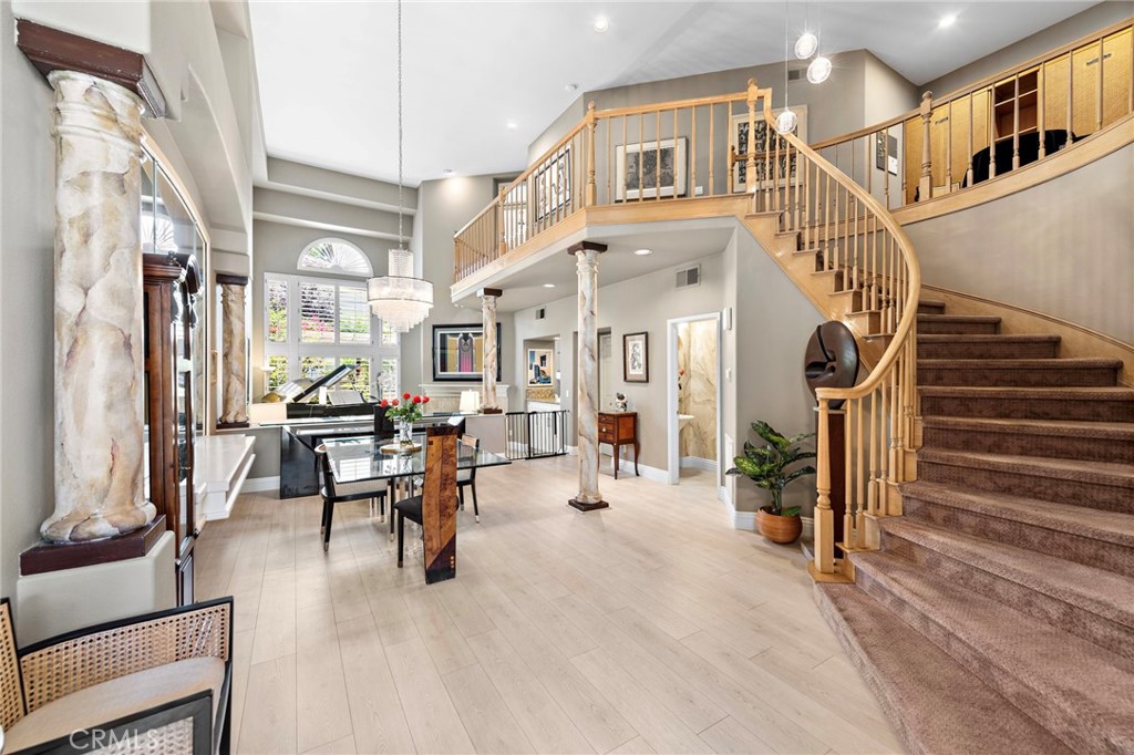 a view of living room with furniture and a chandelier