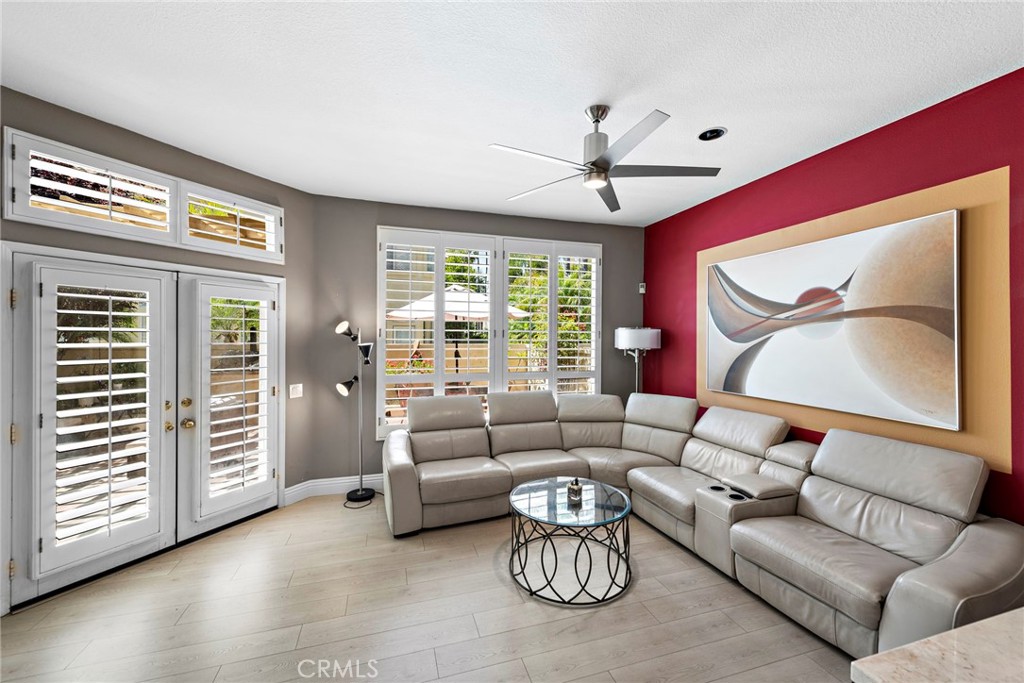 26481 La Scala Laguna Hills, CA 92653 - Photo 14 of 33 a living room with furniture and a large window