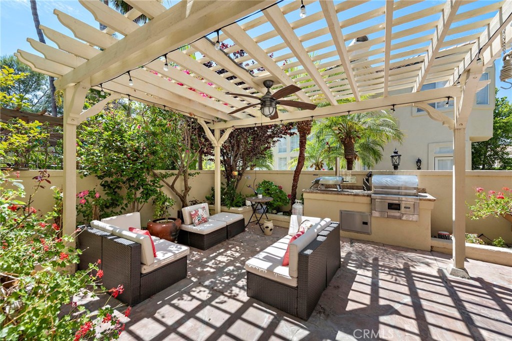 26481 La Scala Laguna Hills, CA 92653 - Photo 21 of 33 a building outdoor space with patio furniture and potted plants