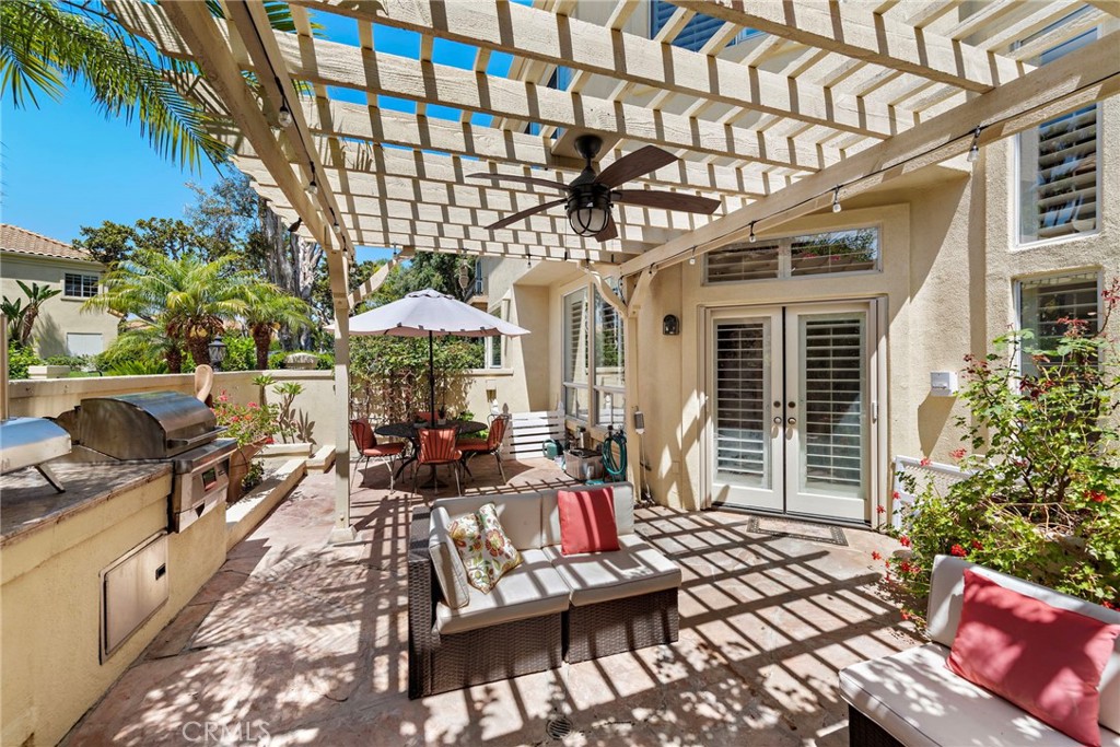 26481 La Scala Laguna Hills, CA 92653 - Photo 24 of 33 a view of a chairs and tables in the patio