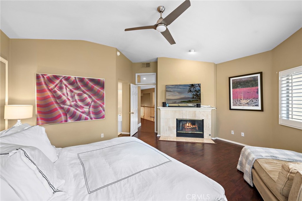 26481 La Scala Laguna Hills, CA 92653 - Photo 26 of 33 a living room with furniture and a fireplace