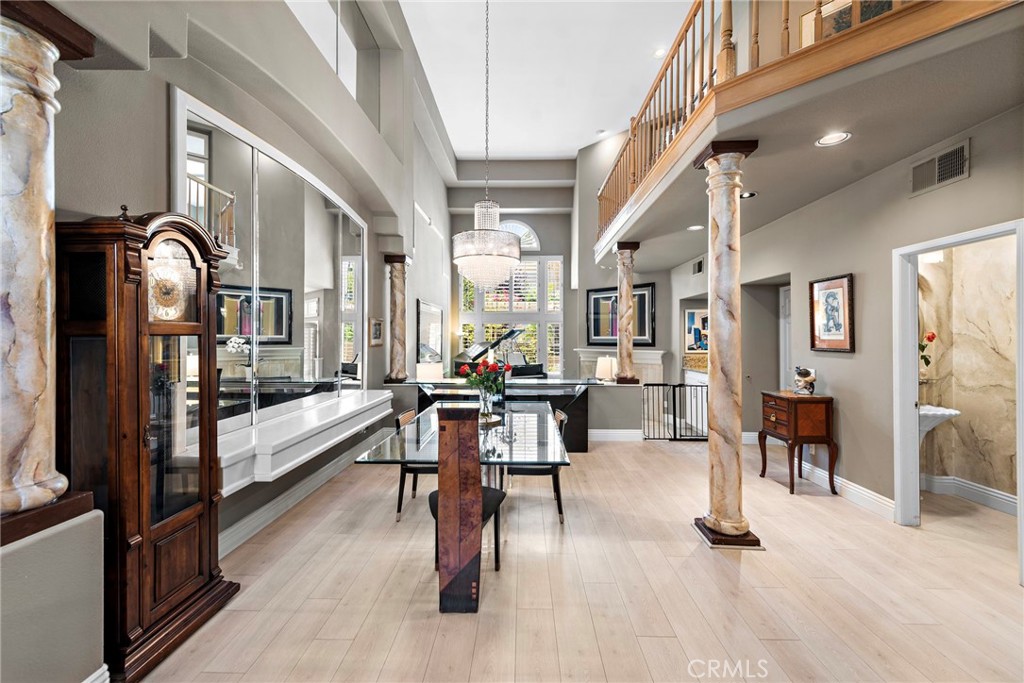 26481 La Scala Laguna Hills, CA 92653 - Photo 5 of 33 a view of a dining room with furniture window and wooden floor