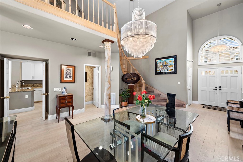 26481 La Scala Laguna Hills, CA 92653 - Photo 7 of 33 a view of a dining room with furniture and a chandelier