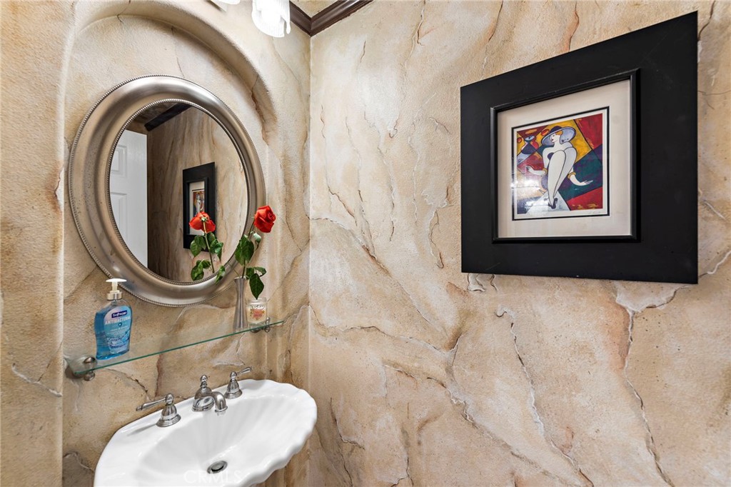 26481 La Scala Laguna Hills, CA 92653 - Photo 9 of 33 a bathroom with a sink and a mirror