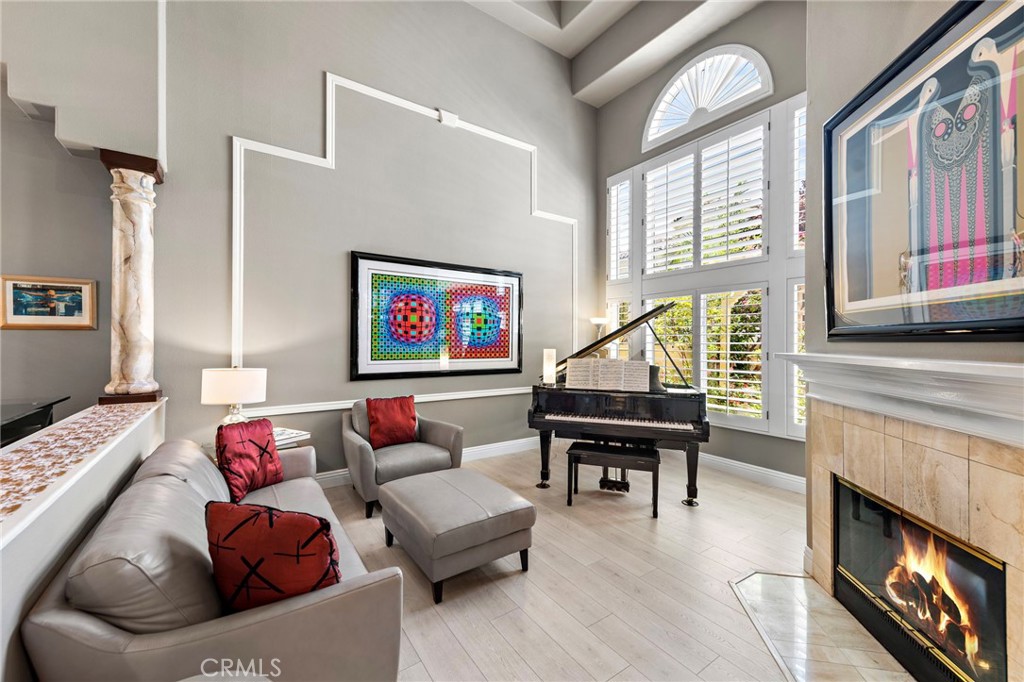 26481 La Scala Laguna Hills, CA 92653 - Photo 10 of 33 a living room with furniture and a fireplace