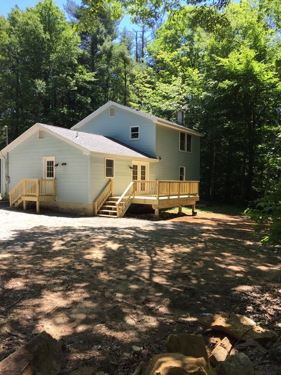 15 Barre Road Templeton, MA 01468 - Photo 2 of 14 a front view of a house with a yard and garage